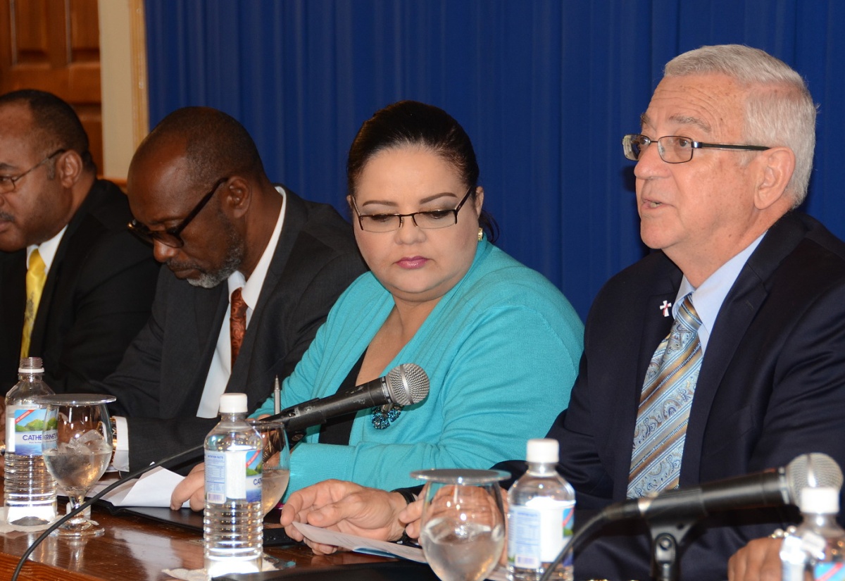 Minister of Education, Hon. Rev. Ronald Thwaites (right), gives an update on the postponement of the Grade Six Achievement Test during a press briefing, held at Jamaica House on Monday, March 16. Listening (from left) are: Director General of the Office of Disaster Preparedness and Emergency Management (ODPEM), Major Clive Davis; Minister of State in the Ministry of Local Government and Community Development, Hon. Colin Fagan and  Information Minister, Senator the Hon. Sandrea Falconer.