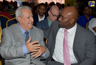 Science, Energy and Technology Minister, Dr. the Hon. Andrew Wheatley (right), converses with Chief Information Officer for the Government of Jamaica, Dr. Louis Shallal,  during the National Cyber Awareness Activity Day at the Police Officers’ Club in St. Andrew on Wednesday, October 25. The event, which was organised by the Jamaica Cyber Incident Team (JA-CIRT), formed part of activities marking Cyber Security Awareness Month during October.  

