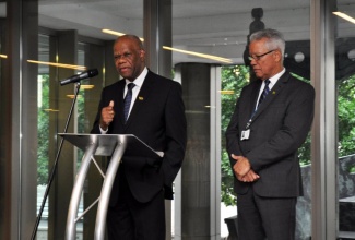 High Commissioner to the United Kingdom (UK), His Excellency Seth George Ramocan (left), addresses the launch of Jamaica’s candidature for re-election to the International Maritime Organization (IMO) Council for the period 2018-2019 in London on July 6. At right is Director General of the Maritime Authority of Jamaica (MAJ), and Jamaica’s Special Envoy to the IMO, Rear Admiral Peter Brady.