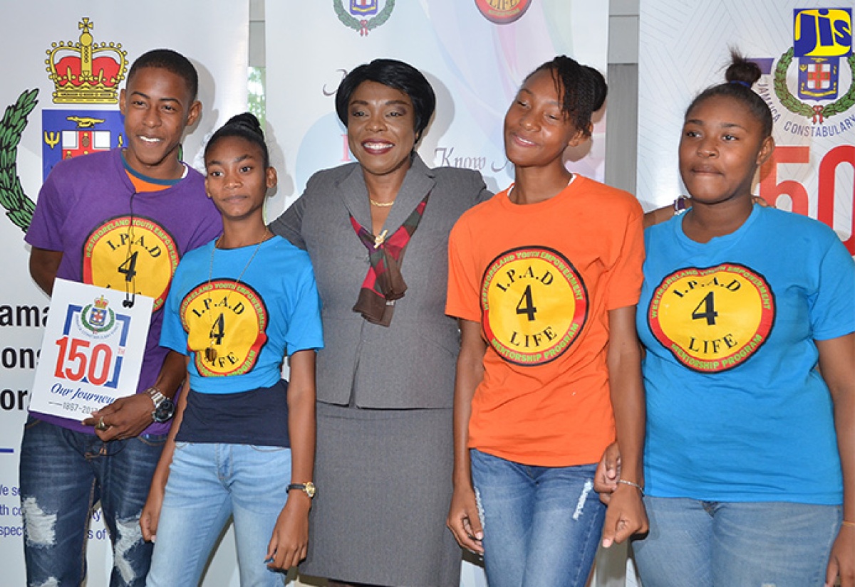 Acting Commissioner of Police, Novelette Grant (centre) with participants of the Jamaica Constabulary Force (JCF) IPAD Youth Empowerment and Mentorship Camp programme, following a corporate breakfast on March 29 at the Terra Nova All-Suite Hotel in Kingston, which was used to seek sponsorship for the expansion of the programme. IPAD, an acronym for Identity, Purpose, Attitude, Destiny, is aimed at social intervention for youth. 