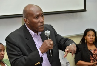 Director, Taxation Policy Division, Ministry of Finance and Planning, Ian Scarlett, emphasises a point during a presentation to business students at a lecture, hosted by the School of Business Administration at the University of Technology (UTech), in Kingston, on September 11. Mr. Scarlett’s presentation focused on the Government’s Economic Reform Programme (ERP). 