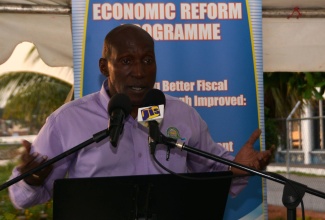 Director of Taxation Policy in the Ministry of Finance and Planning, Ian Scarlett, explains Government’s Economic Reform Programme to residents of  St. Elizabeth, at a Town Hall meeting held on Wednesday (Sept. 24), at the new public park in Black River.