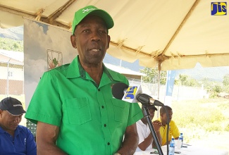 Minister without Portfolio in the Ministry of Industry, Commerce, Agriculture and Fisheries, Hon. J.C. Hutchinson, addressing potato farmers in Hounslow, St. Elizabeth, on Friday, March 10.