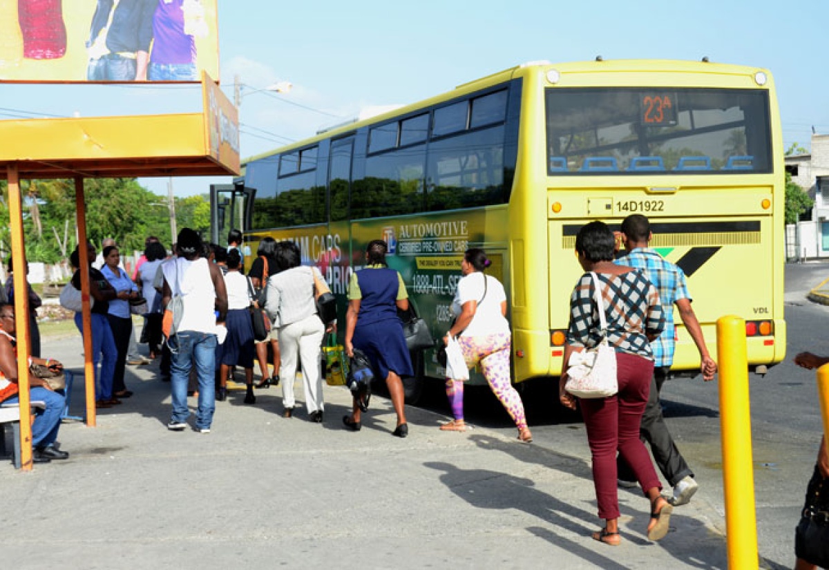 Commuters boarding  a JUTC bus which plies the Spanish Town to Half-Way Tree route.