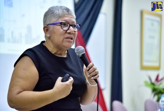 Chief Technical Director, Planning, Monitoring and Evaluation Division, Office of the Prime Minister, Jacqueline Lynch-Stewart, speaks at the 2018 Norman Manley Lecture at the University of the West Indies,  Mona Campus in St. Andrew, on Thursday (March 15). The lecture, which focused on the topic ‘National Identification System: What Does it Mean?’, was organised by the Norman Manley Law School Students’ Association.