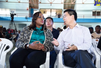 Member of Parliament for East Rural St. Andrew, the Most Hon. Juliet Holness (left), converses with Ambassador of the People’s Republic of China to Jamaica, His Excellency Niu Quingbao, during the inaugural coffee industry symposium at the Chinese Benevolent Association in Kingston on Sunday (November 19).