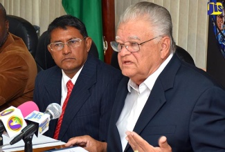 Minister of Industry, Commerce, Agriculture and Fisheries, Hon. Karl Samuda (right), addressing media briefing on September 29, at the Ministry’s offices in New Kingston. He gave an update on the Frosty Pod Rot disease, which is affecting local cocoa. At left is Permanent Secretary in the Ministry, Mr. Reginald Budhan.