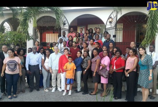 Chargé d’Affaires at the Embassy of the Bolivarian Republic of Venezuela, Luisa Gutiérrez (fifth left) and her husband, Luis Felipe Bellorin (fourth left),  with new students and staff of the Venezuelan Institute, following a ceremony held on February 19 at the Institute, 24 Windsor Avenue, Kingston, to welcome new candidates.

