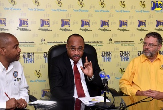 Director General of the Office of Disaster Preparedness and Emergency Management (ODPEM), Major Clive Davis (centre), speaks at a JIS ‘Think Tank’ on January 10. Listening (from left) are: Head of the Meteorological Service, Evan Thompson,  and Head of the Earthquake Unit at The University of the West Indies, Mona,  Professor Simon Mitchell. 

