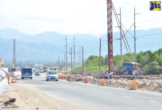 Motorists travel along the Mandela Highway in St. Catherine, which is being widened from four to six lanes. The US$64-million project is funded through the Major Infrastructure Development Programme.     