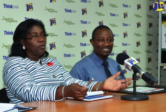 Acting Principal of the Montego Bay Community College in St. James, Dr. Maureen Nelson (left), addresses JIS ‘Think Tank’ in Montego Bay on  November 7. At right is  Director of Marketing and Public Relations at the institution,  Ruiz Warren. 