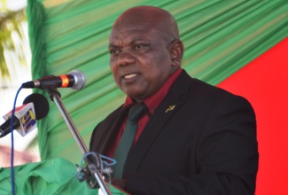 Mayor of St. Ann’s Bay, Councillor Desmond Gilmore, addressing a ceremony to commemorate the 128th anniversary of the birth of National Hero, the Rt. Excellent Marcus Garvey, at the St. Ann Parish Library in St. Ann’s Bay, on Monday, August 17. At the function, Mayor Gilmore announced that Darren Phillips, who will be attending the Marcus Garvey Technical High School in September, is the recipient of a $250,000 Marcus Garvey Scholarship, given by the St. Ann Parish Council. Darren, who attended Clapham Primary School, was awarded for his performance in the GSAT exam.