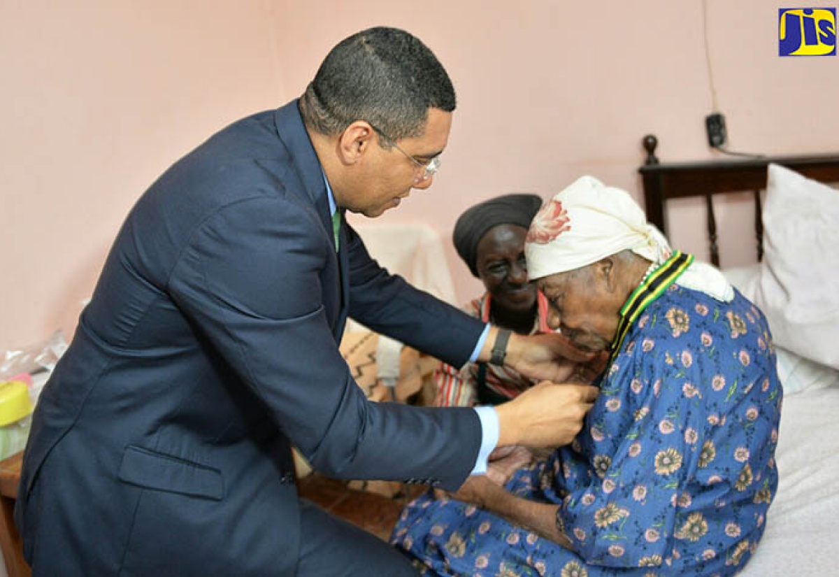 PM Awards Medal to World’s Oldest Living Person