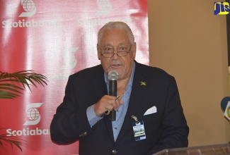 Minister of Transport and Mining, Hon. Mike Henry, addressing the signing ceremony for a J$5 billion (US$40 million) loan agreement between MBJ Airports Limited and Scotiabank for the upgrading of the Sangster International Airport, held at the airport in Montego Bay on Tuesday (January 9).