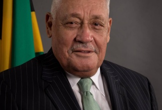 Minister of Labour and Social Security Lester Michael Henry, CD, MP