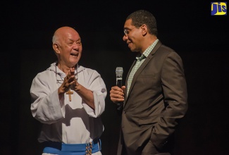 Prime Minister, the Most Hon. Andrew Holness (right), speaking with Founder of Missionaries of the Poor, Father Richard Ho Lung, during the staging of the musical ‘Moses’, on November 27 at the National Arena in Kingston. The show, which was put on by Father Ho Lung and Friends, aimed to raise money to assist the destitute and homeless. The show was staged earlier this month in Charlotte, North Carolina, in the United States.  
 
