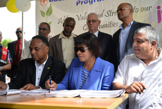 Prime Minister, the Most Hon. Portia Simpson Miller (3rd right), breaks ground for the $64 million expansion and rehabilitation of the Mandeville Primary and Junior High School in Central Manchester on Friday, November 27. Others (from left), are: Managing Director of the Jamaica Social Investment Fund (JSIF), Omar Sweeney; the School Board’s Chairman, Dr. Lloyd Quarrie; National Security Minister and Central Manchester Member of Parliament, Hon. Peter Bunting; Councillor for the Mandeville Division of the Manchester Parish Council, Jones Oliphant; and Education Minister, Hon. Rev. Ronald Thwaites. 