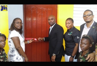 Minister of Science, Energy and Technology, Dr. the Hon. Andrew Wheatley (third left), opens the  Mount Peto Primary School Computer Laboratory, at the Mount Peto Baptist Church in Hanover on February 17. Sharing the occasion (from second left) are Principal of the Mount Peto Primary School, Nadienne Crossman; Chief Executive Officer of the Universal Service Fund, Suzette Buchanan; Member of Parliament for Eastern Hanover, Dave Brown and students of the school. 