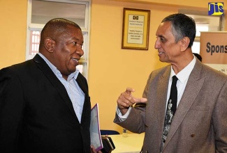 Consultant Anaesthetist, Dr. Nitin Shah (right), in discussion with Regional Director, Southern Regional Health Authority, Michael Bent, chats with Dr. Nitin Shah, following the recent free cataract surgeries performed at the Mandeville Regional Hospital in Manchester.