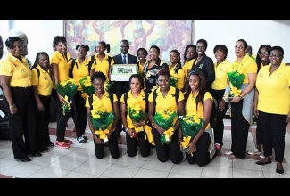 The Honourable Olivia Grange, Minister of Culture, Gender, Entertainment and Sport; Permanent Secretary, Denzil Thorpe, President Dr Paula Daley-Morris and Officials of Netball Jamaica; Sponsor Representative, Coaches Sasher-Gaye Henry and Marvette Anderson with members the Sunshine Girls team who won a bronze medal at the just concluded Commonwealth Games in Australia. The team was met by the Minister at the Norman Manley International Airport upon their arrival today (April 17).