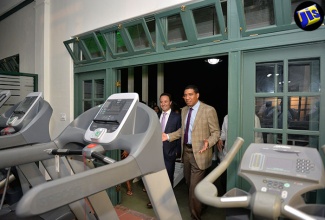 Prime Minister, the Most Hon. Andrew Holness (right) is being led on a tour of the Caribbean Cement Company Limited Sports and Wellness Centre by the company’s General Manager, Alejandro Vares, at the facility’s official opening, at Harbour Head in Rockfort, on September 8. 