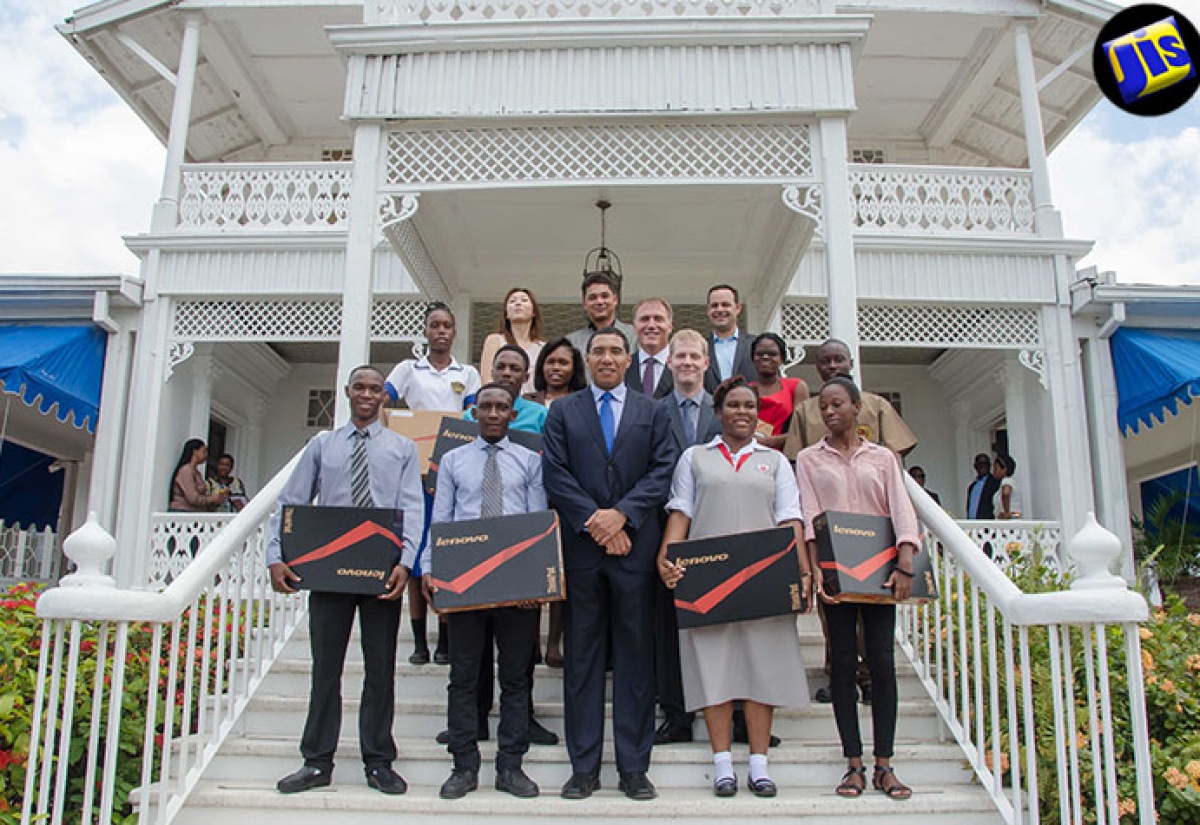 Prime Minister, the Most Hon. Andrew Holness (centre, front row), on the steps of Vale Royal with high-school and university students who received laptop computers through a partnership with Lenovo and AMD Inc. Representatives from the international computer manufacturers are also pictured, including Corporate Vice President of the Lenovo Account at AMD Inc, Mr. David Bennett (second right, second row); and Director of Channel Sales at Lenovo, Michael Abplanalp (second right, third row).