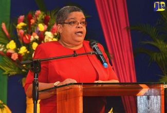 Permanent Secretary in the Ministry of Justice, Carol Palmer, addressing Justices of the Peace from Westmoreland, Hanover, St. James and Trelawny, during a training session at the West Jamaica Conference Centre in Montego Bay, St. James on Wednesday (February 22).