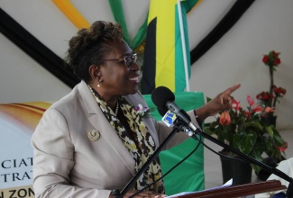 Director of Public Prosecutions, Paula Llewellyn, addresses  recent awards ceremony in Clark’s Town, Trelawny,  for several long serving Justices of the Peace for their outstanding contribution to the parish.