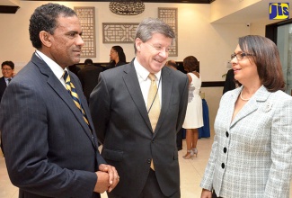 Minister of Labour and Social Security, Hon. Shahine Robinson (right), converses with Director General, International Labour Organization (ILO), Guy Ryder (centre); and Deputy Premier and Minister for Natural Resources and Labour, Government of the Virgin Islands, Dr. the Hon. Kedrick Pickering. Occasion was the opening of the 10th ILO meeting of Caribbean Ministers of Labour at The Jamaica Pegasus hotel in New Kingston on February 23. 