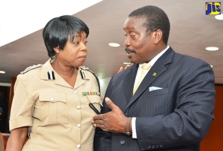 In this file photo, Minister of National Security, Hon. Robert Montague, is in discussion with Acting Commissioner of Police, Novelette Grant (right), during an interactive session with heads of the Jamaica Constabulary Force (JCF) at the Jamaica Conference Centre in downtown Kingston on Tuesday (January 17).
