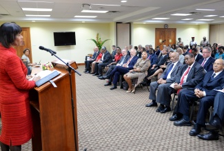 Prime Minister, the Most Hon. Portia Simpson Miller (left), addresses members of the diplomatic corps at the University of the West Indies’ (UWI) Regional Headquarters in St. Andrew this morning (February 10), as part of activities for Diplomatic Week 2015.