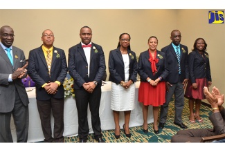 Minister of Education, Youth and Information, Senator the Hon. Ruel Reid (left), applauds principals inducted into the National College for Educational Leadership (NCEL) Executive Principals’ League, during a ceremony held recently at The Marriott Hotel Courtyard, in New Kingston. They are (from second left) Principal, York Castle High, Raymon Treasure; Principal of Belmont Academy, Rayon Simpson; Principal at the Petersfield Primary and Infant, Susan Rattray-Hammond; Principal of Ardenne High, Nadine Molloy; Principal for Manchester High, Jasford Gabriel; and Principal of Allman Town Primary, Kandi-Lee Crooks-Smith.