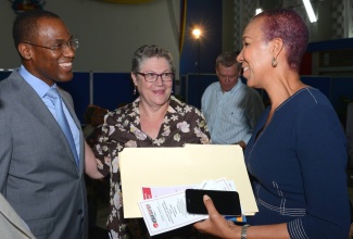 Minister of State in the Ministry of Finance and the Public Service, Fayval Williams (right), shares a light moment with Deputy Chair of the Economic Growth Council (EGC), Ambassador Nigel Clarke; and Chair, University Research Days Steering Committee, Professor Denise Eldemire-Shearer, at a public lecture held at the University of the West Indies (UWI) Mona Campus on February 1.  