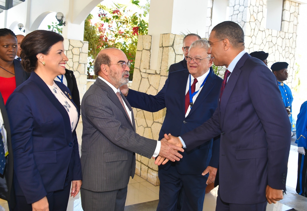 Prime Minister, the Most Hon. Andrew Holness (right), is introduced to Director General of the Food and Agriculture Organization (FAO), Dr. José Graziano da Silva (second left) by Minister of Industry, Commerce, Agriculture and Fisheries, Hon. Karl Samuda (second right). Occasion was the opening ceremony for the FAO’s Regional Conference for Latin America and the Caribbean, on March 7 at the Montego Bay Convention Centre, St. James. At left is Constitutional Vice President of the Dominican Republic, Special Ambassador of FAO, Dr. Margarita Cedeno.