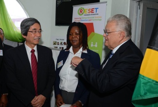 Minister of Industry, Investment, Agriculture and Fisheries, Hon. Karl Samuda (right), is in conversation with Japan’s Ambassador to Jamaica, His Excellency Masanori Nakano and Executive Chairman, Restoring Entrepreneurial Success Through Education and Technology (RESET) Caribbean Foundation, Collette Campbell, at the official opening of a training facility at RESET’s offices on Brompton Road in Kingston on May 26.