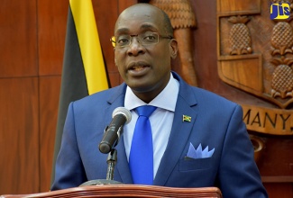 Minister of Education, Youth and Information, Senator the Hon. Ruel Reid, addresses a post-Cabinet press briefing at Jamaica House on October 12.