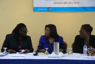 Chief Justice, Hon. Zaila McCalla (centre); and Director of Public Prosecutions (DPP), Paula Llewellyn (right), are in discussion with Acting Puisne Judge and President of the Association of Resident Magistrates, Justice Cresencia Brown, at a Restorative Justice Protocol and Case Management System Sensitization workshop held on Saturday (Nov. 9), at the Jewel Paradise Cove Beach Resort and Spa in Runaway Bay, St. Ann.