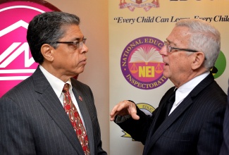 Education Minister, Hon. Rev. Ronald Thwaites (right), emphasizes a point to President and Chief Executive Officer, Victoria Mutual Building Society (VMBS), Richard Powell, during Tuesday’s (June 16) power breakfast at the Hilton Rose Hall Resort, Montego Bay, St. James, which was sponsored by the financial institution. The breakfast formed part of activities scheduled for the 2015 Biennial Jamaica Diaspora Conference, being held from June 15 to 18, at the Montego Bay Convention Centre, under the theme: ‘Jamaica and the Diaspora: Linking for Growth and Prosperity’.