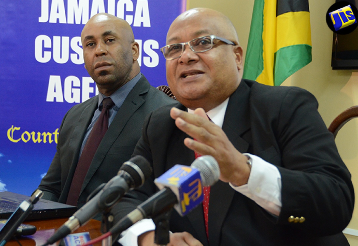 Chief Executive Officer of the Jamaica Customs Agency, Major (Ret’d) Richard Reese, makes a point during a press briefing held at the Agency’s head office, New Port East, Kingston, on August 4. Looking on is Senior Director and Chief Information Officer, Jamaica Customs Agency, Andre Williams.