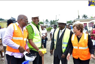 National Security Minister, Hon. Robert Montague (second right), shares a light moment with Mayor of  Port Maria, Councillor Richard Creary (second left); Central St. Mary Member of Parliament, Dr. Morais Guy (left); and Acting Custos of St. Mary, Maxine Marsh, at the ground-breaking ceremony for a new police station in Port Maria on March 7. 