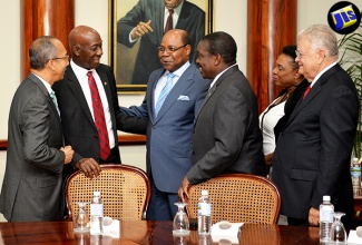 Prime Minister of the Republic of Trinidad and Tobago, Dr. the Hon. Keith Rowley (second left), engages in a light discussion with several of Jamaica’s Government Ministers prior to the start of a bilateral meeting at the Office of the Prime Minister on Monday (July 18). They are (from left) Minister without Portfolio in the Ministry of Economic Growth and Job Creation, Hon. Dr. Horace Chang; Minister of Tourism, Hon. Edmund Bartlett; Minister of National Security, Hon. Robert Montague; Minister of Culture, Gender, Entertainment and Sport, Hon. Olivia Grange; and Minister of Industry, Commerce, Agriculture and Fisheries, Hon. Karl Samuda. Prime Minister Rowley is in the island on an official visit from July 17-21.