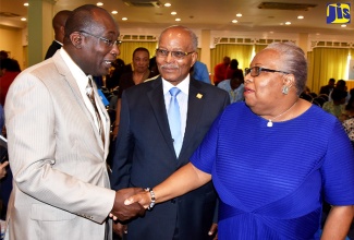 Minister of Education, Youth and Information, Senator the Hon. Ruel Reid (left), is greeted by Commissioner/Chief Executive Officer, Jamaica Tertiary Education Commission (J-TEC), Maxine Henry-Wilson, when he arrived at The Knutsford Court Hotel in St. Andrew on Wednesday (February 15) to attend the launching ceremony for the National Qualification Framework of Jamaica (NQF-J).   The NQF-J is a new national policy for regulated qualifications in Jamaica’s education and training system.                              