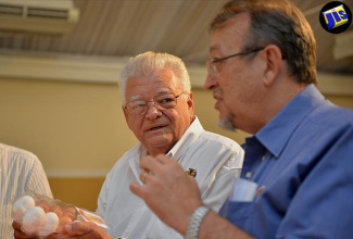 Minister of Industry, Commerce, Agriculture and Fisheries, Hon. Karl Samuda (left), and Vice President of Marketing and Agricultural Supplies of the Hi-Pro Division of the Jamaica Broilers Group, Mr. Conley Salmon, in conversation following a breakfast meeting at the Terra Nova All-Suite Hotel in Kingston on August 12 to discuss an ongoing campaign to promote increased egg consumption by Hi-Pro and the United States Soybean Export Council (USSEC) in partnership with the Jamaica Egg Farmers Association (JEFA).