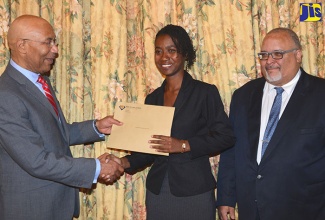 Governor-General, His Excellency the Most Hon. Sir Patrick Allen (left), congratulates Shakeba Foster on being named Jamaica's 2017 Rhodes Scholar during a brief ceremony at King’s House on November  17.  At right is Jamaica’s Secretary to the Rhodes Trust and Secretary of the Jamaican Selection Committee, Peter Goldson.