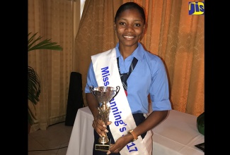 The Board of Supervision Outreach and Welfare Committee’s Top Caribbean Secondary Education Certificate (CSEC) scholarship recipient, Shanique Sommerville, poses with her trophy, which was presented at the awards ceremony held recently at the Mona Visitors’ Lodge in St. Andrew. Shanique is the reigning Miss Manning’s School  2017.