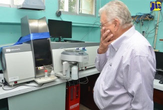 Industry, Commerce, Agriculture and Fisheries Minister, Hon. Karl Samuda, looks at equipment at the Sugar Industry Research Institute (SIRI) in Mandeville, which was donated by the European Union. Occasion was the opening of the Sugar Industry Authority’s (SIA) inaugural post-crop seminar at SIRI on September 21.