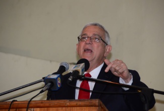 Minister of Education, Hon. Rev. Ronald Thwaites, addresses the launch of the North West St. Ann skills training and night school programme on Friday, December 13, at the St. Hilda’s High School Auditorium in Brown’s Town.