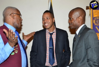 Director, Port Community System (PCS) Operator, Port Authority of Jamaica, Dwain Powell (centre), is in light discussion with Lions Club District Governor, Errol Lee (left) and President, Lions Club of Kingston, Paul Robinson (right). The occasion was the monthly meeting of the Lions Club of Kingston held on September 7 at The Jamaica Pegasus hotel, New Kingston.