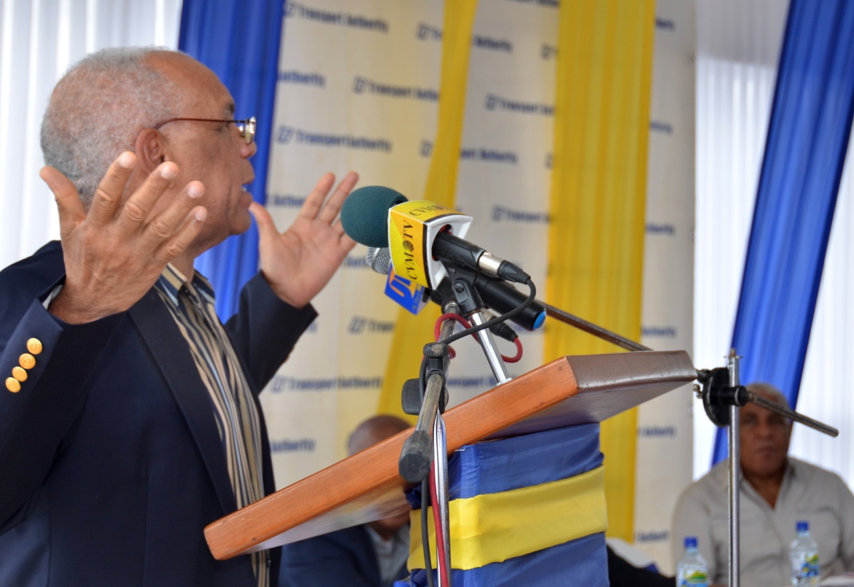 Transport, Works and Housing Minister, Dr. the Hon. Omar Davies, emphasizes a point while addressing Wednesday’s (February 3) official opening of the  new Linstead Transportation Centre, in St. Catherine.