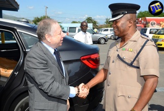 United Nations (UN) Special Envoy for Road Safety and President, Fédération Internationale de l’Automobile (FIA), Jean Todt  (left), is greeted by  Senior Superintendent and Commanding Officer of the Traffic and Highway Division, Jamaica Constabulary Force (JCF), Calvin Allen, on his arrival at the Police Traffic Headquarters in Kingston on August 10.